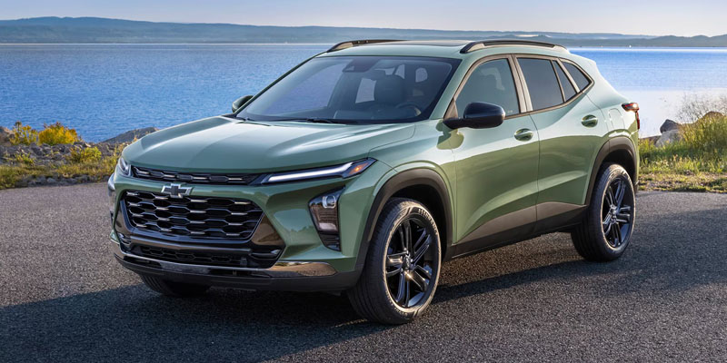 Green Chevrolet Trax SUV parked by the water