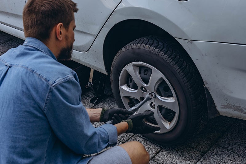 Technician installing tires