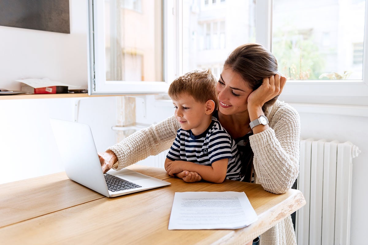 Mother and child browsing on a laptop